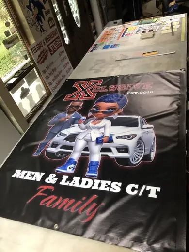 Large printed graphic with cars on a production table