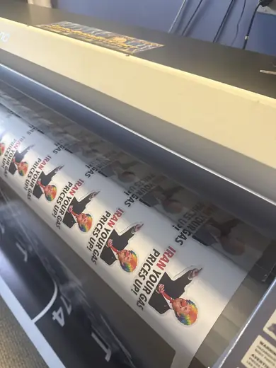 Wide-format printer running a vinyl print in the shop