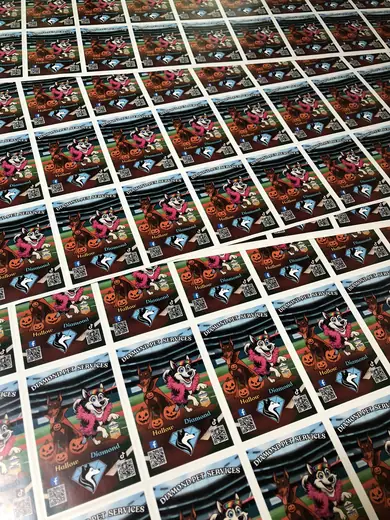 Grid of full-color printed stickers on a sheet